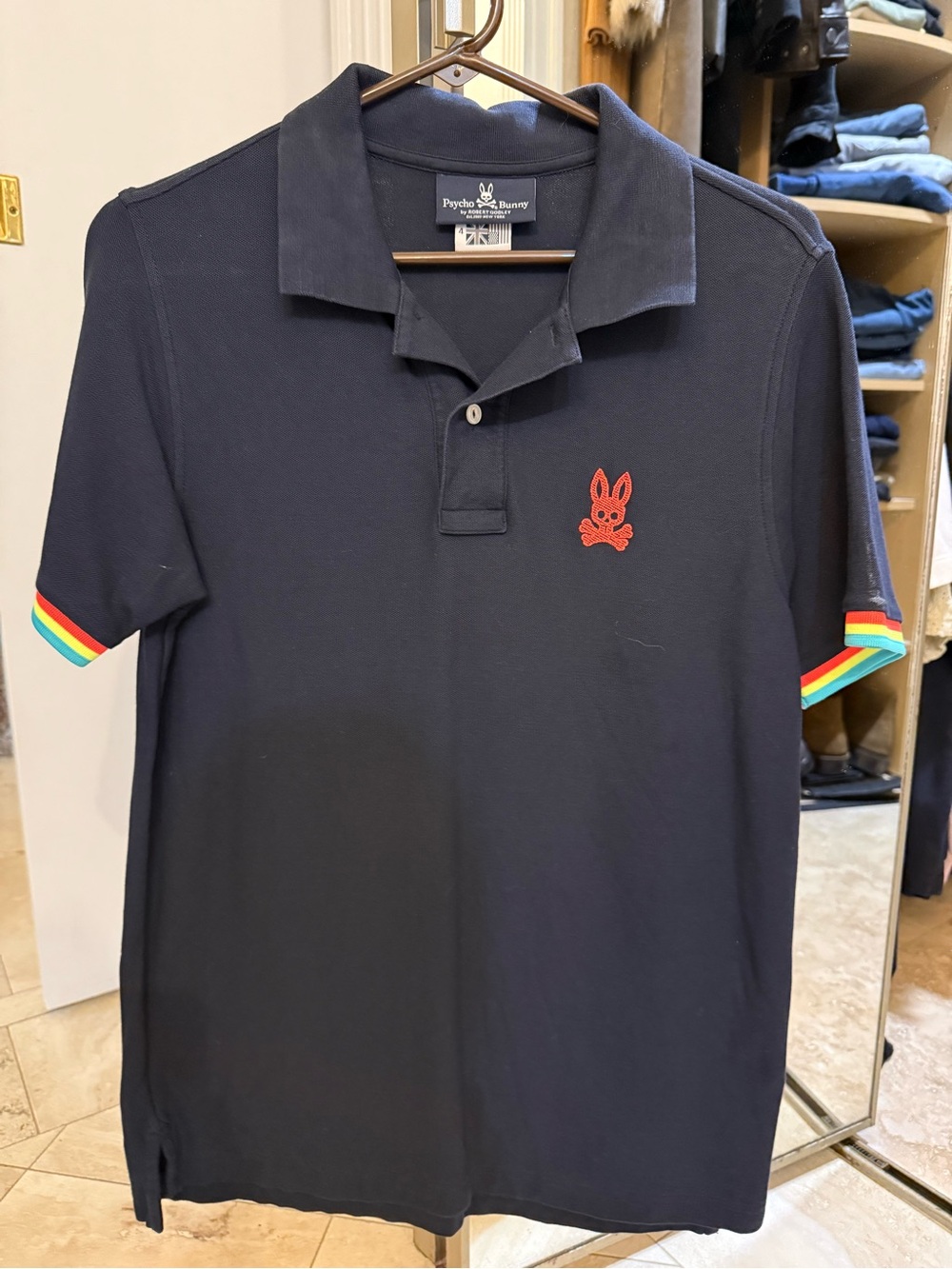 Psycho Bunny mens Navy Polo with Rainbow Sleeve Trim